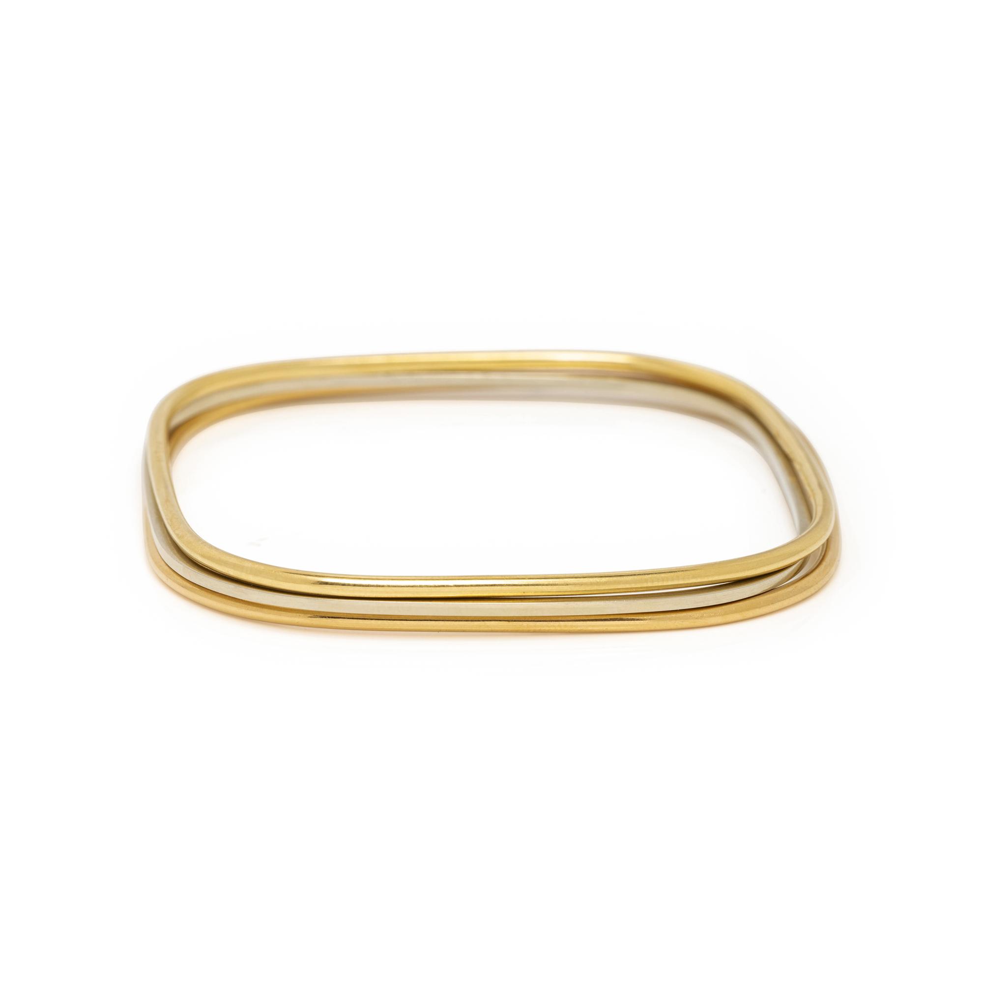 DIHN VAN, CARTIER, TRICOLOR GOLD BANGLE BRACELETS