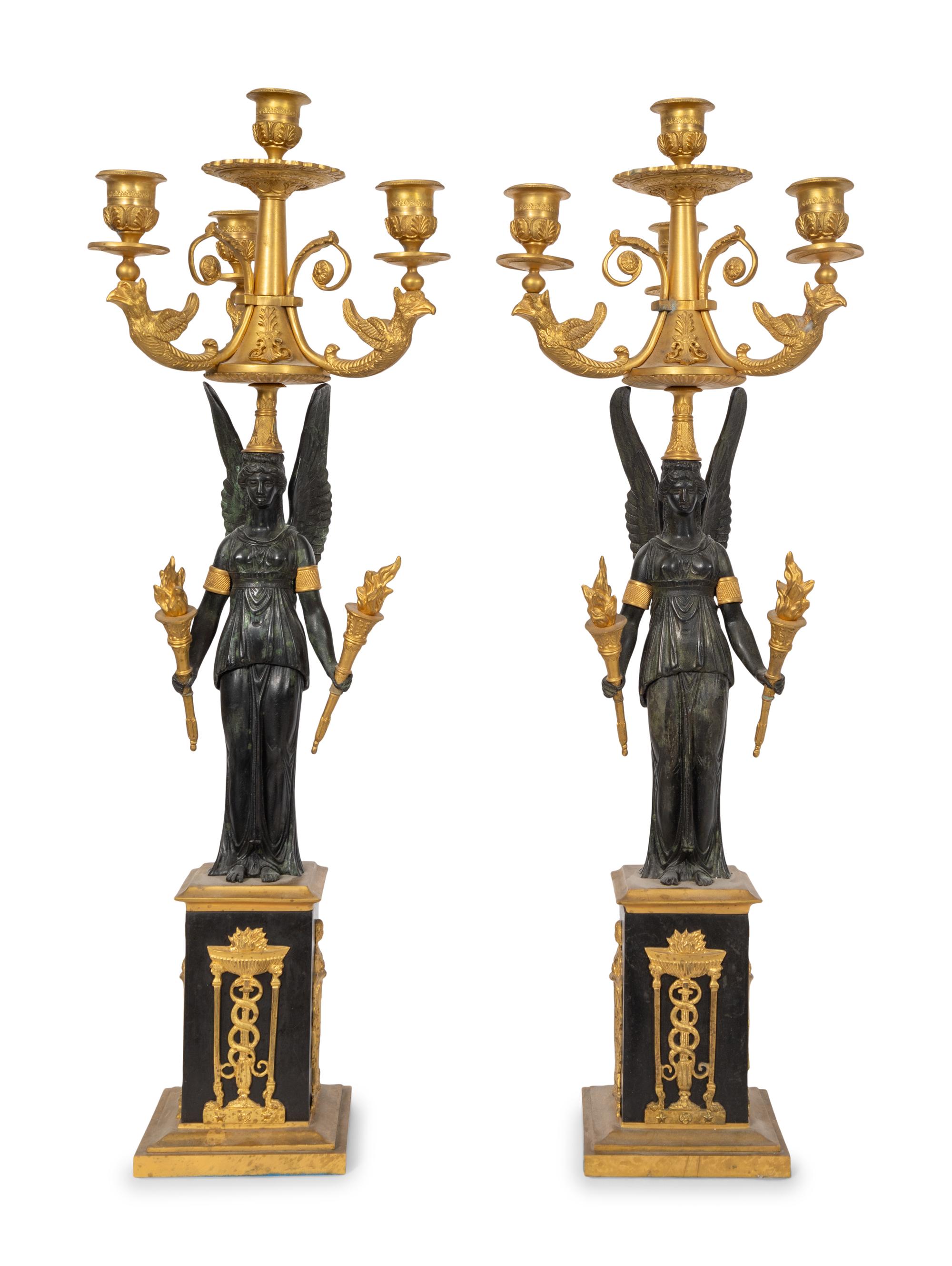 A Pair of Empire Style Gilt and Patinated Bronze Three-Light Candelabra