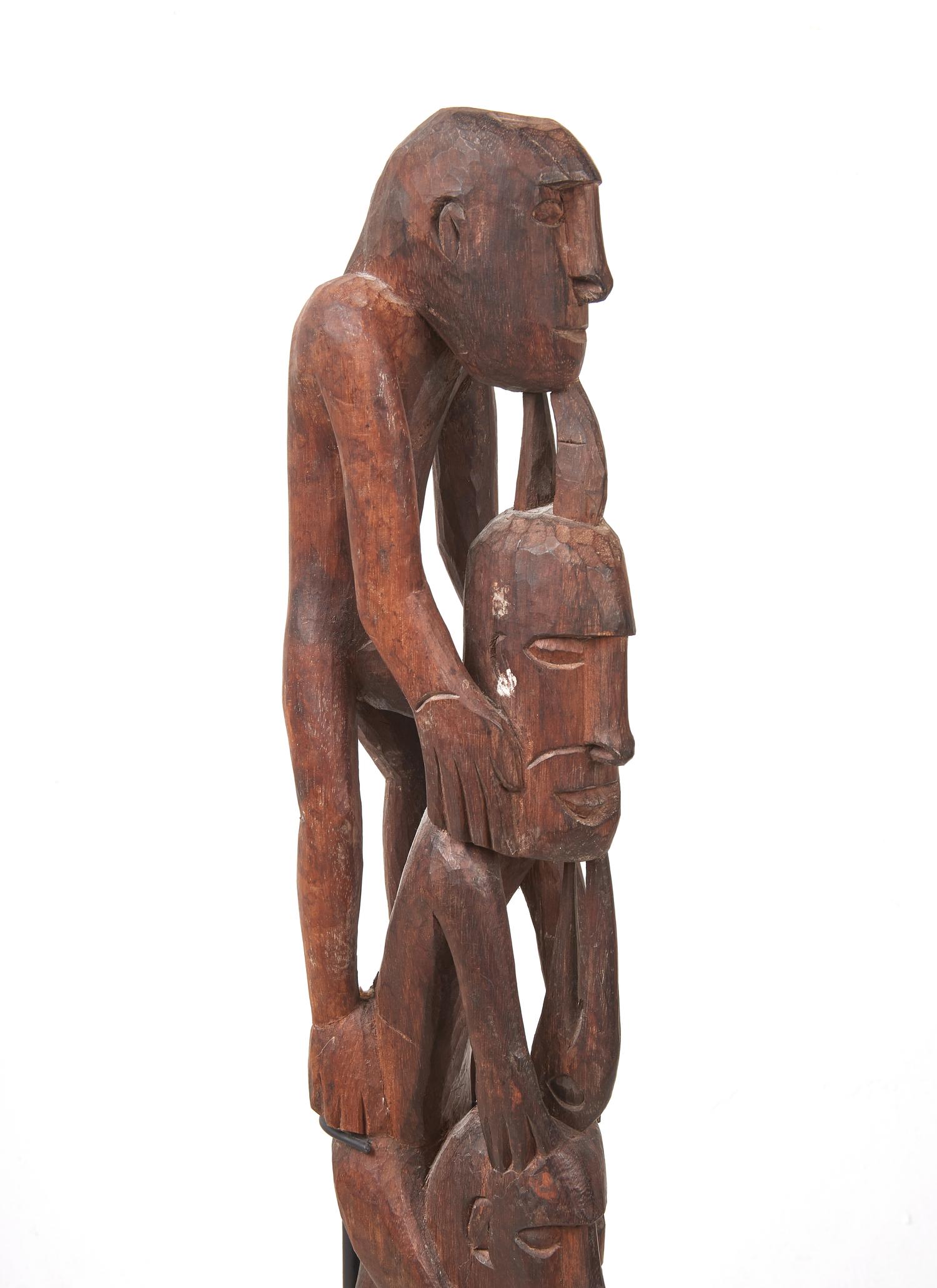An Asmat Figure COMBINED WITH 31