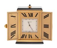 A Cartier Engraved Brass and Onyx Travel Clock
