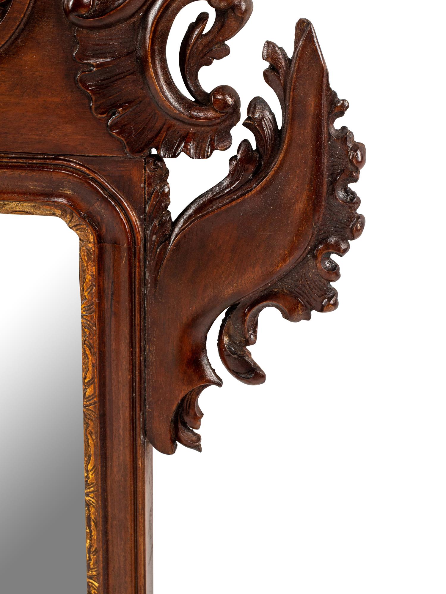 A George III Style Carved and Parcel Gilt Mahogany Mirror