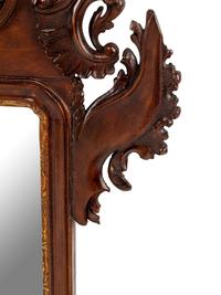 A George III Style Carved and Parcel Gilt Mahogany Mirror