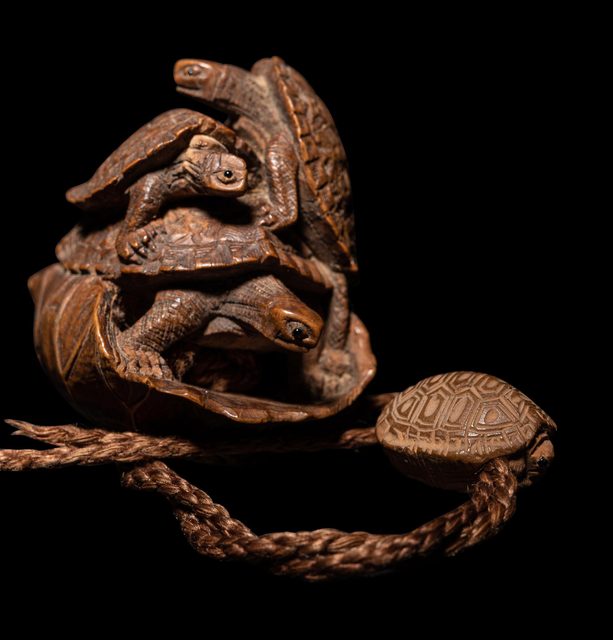 A Japanese Terrapin-Form Boxwood Three- Case Inro, Ojime and Netsuke