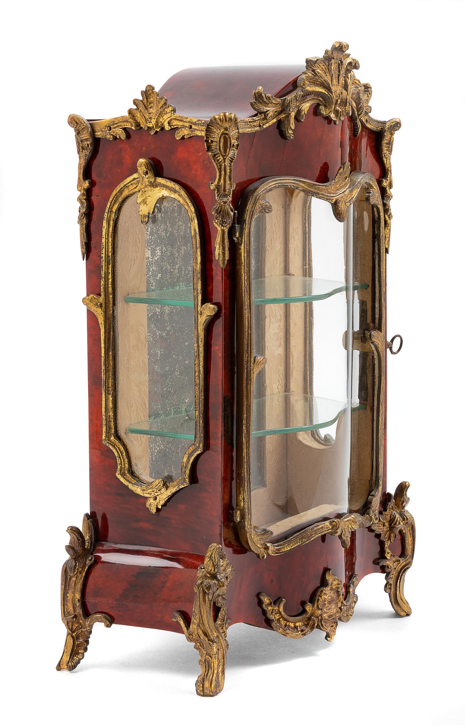 A Diminutive French Gilt Metal Mounted Tortoise Shell Vitrine Cabinet Height 14 inches. — 19TH CENTURY