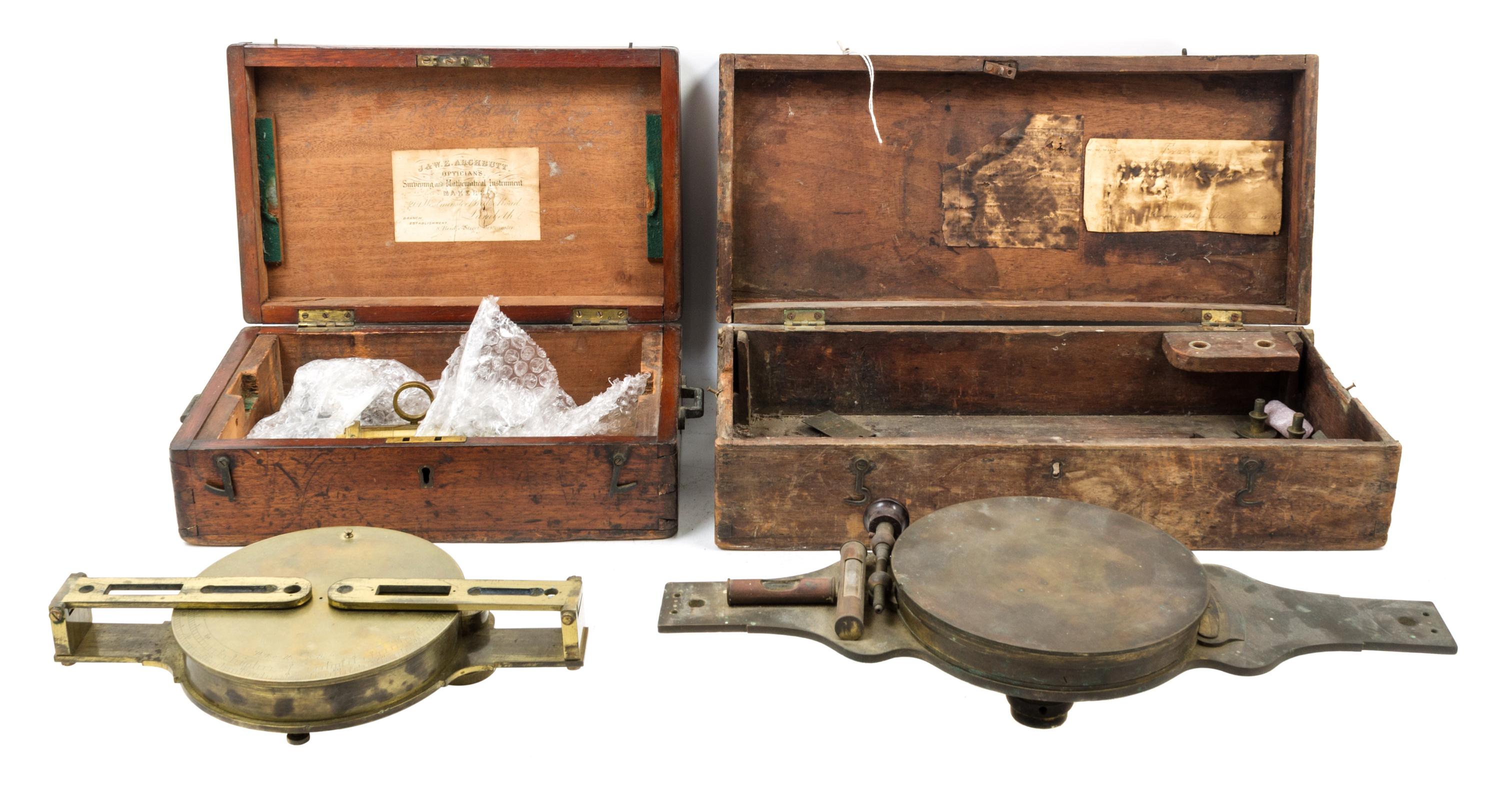 A Group of Two Brass Surveor's Compasses Width of larger example 16 inches.
