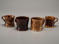 Fifteen Rockingham Glaze Mugs and Pig Banks