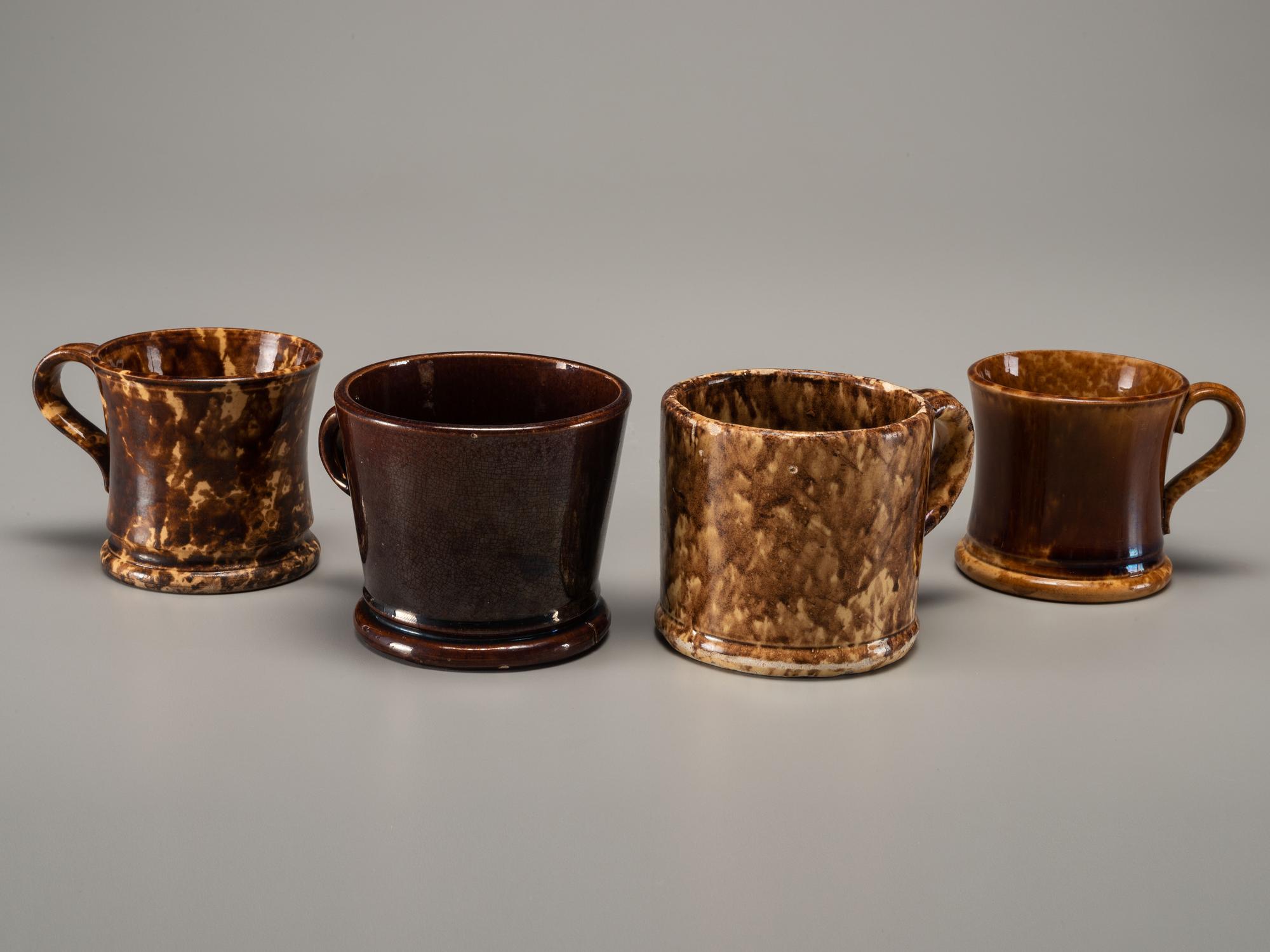 Fifteen Rockingham Glaze Mugs and Pig Banks