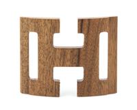 An Hermes Logo Wooden Belt Buckle, 3.5" x 2.5".