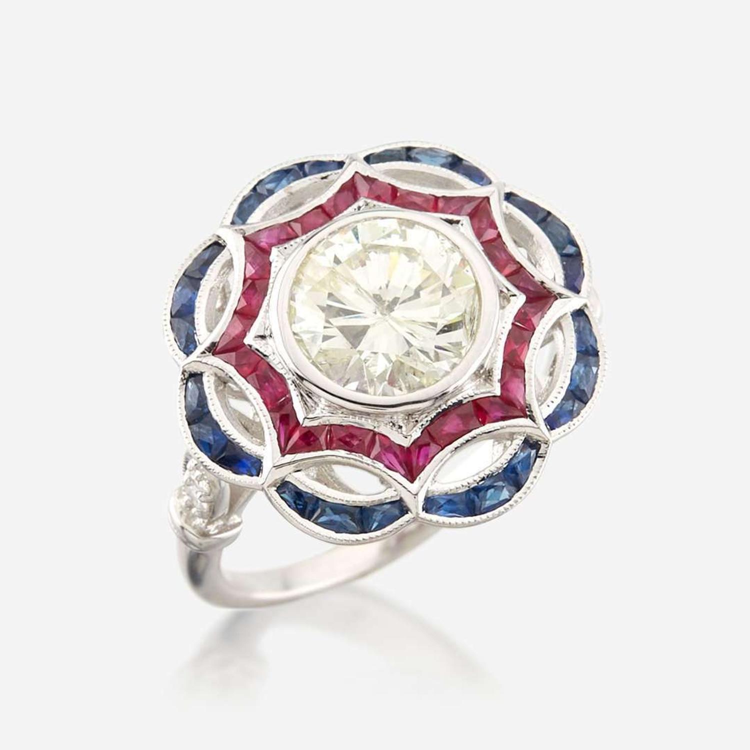 A diamond, ruby, sapphire, and white gold ring
