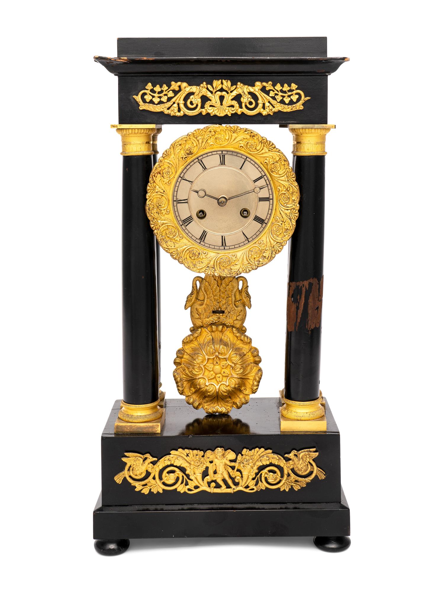 A Charles X Gilt Bronze Mounted Ebonized Fruitwood Clock