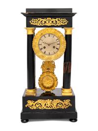 A Charles X Gilt Bronze Mounted Ebonized Fruitwood Clock