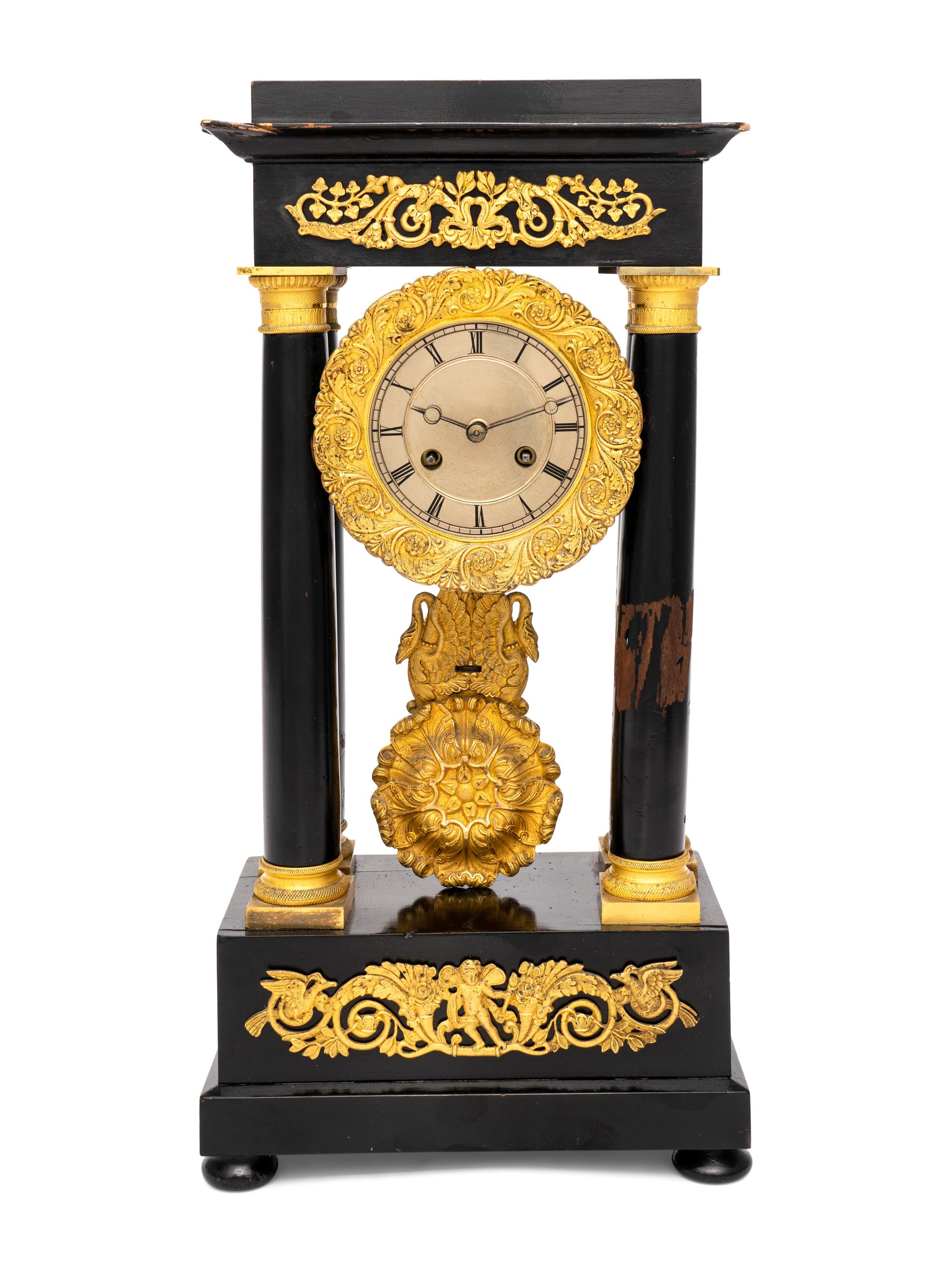A Charles X Gilt Bronze Mounted Ebonized Fruitwood Clock