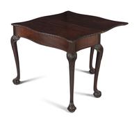 A George III Carved Mahogany Flip-Top Table