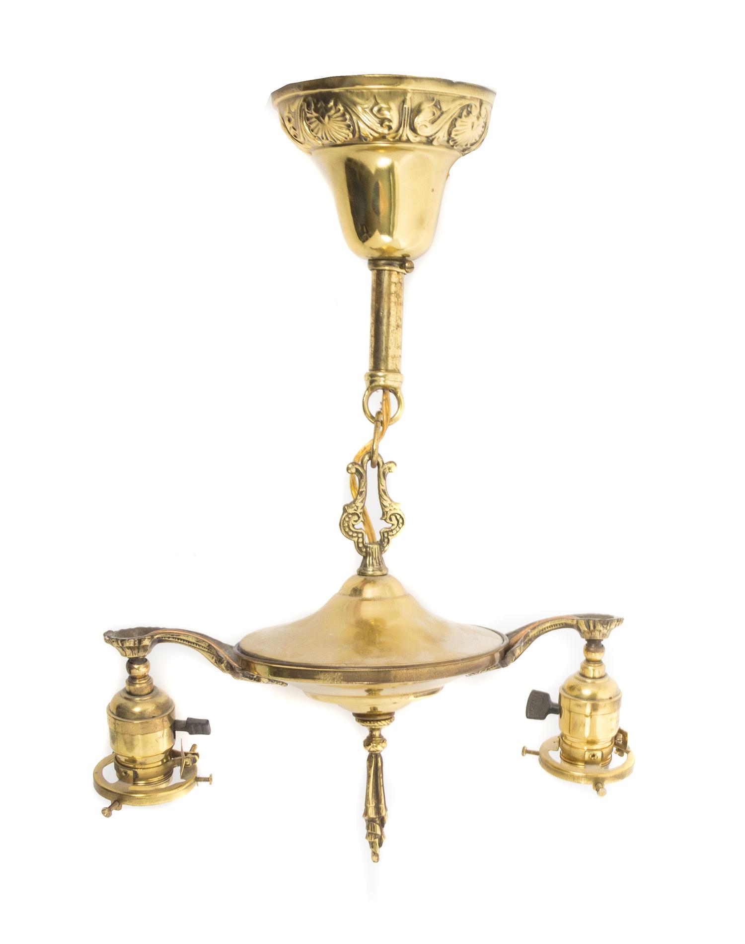 Steuben, EARLY 20TH CENTURY, a pair of Aurene glass shades, with pulled feather decoration, together with a brass two-light fixture