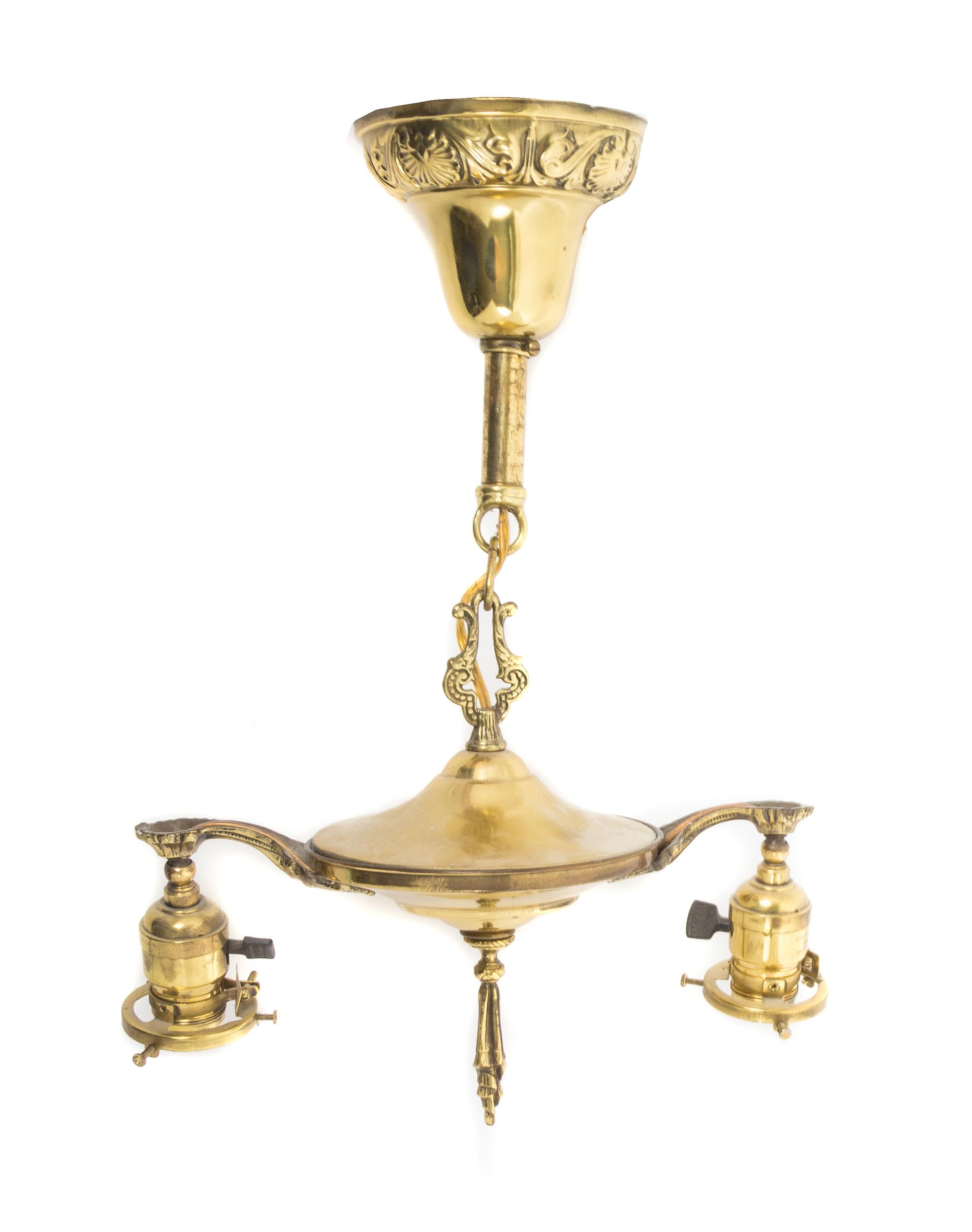 Steuben, EARLY 20TH CENTURY, a pair of Aurene glass shades, with pulled feather decoration, together with a brass two-light fixture