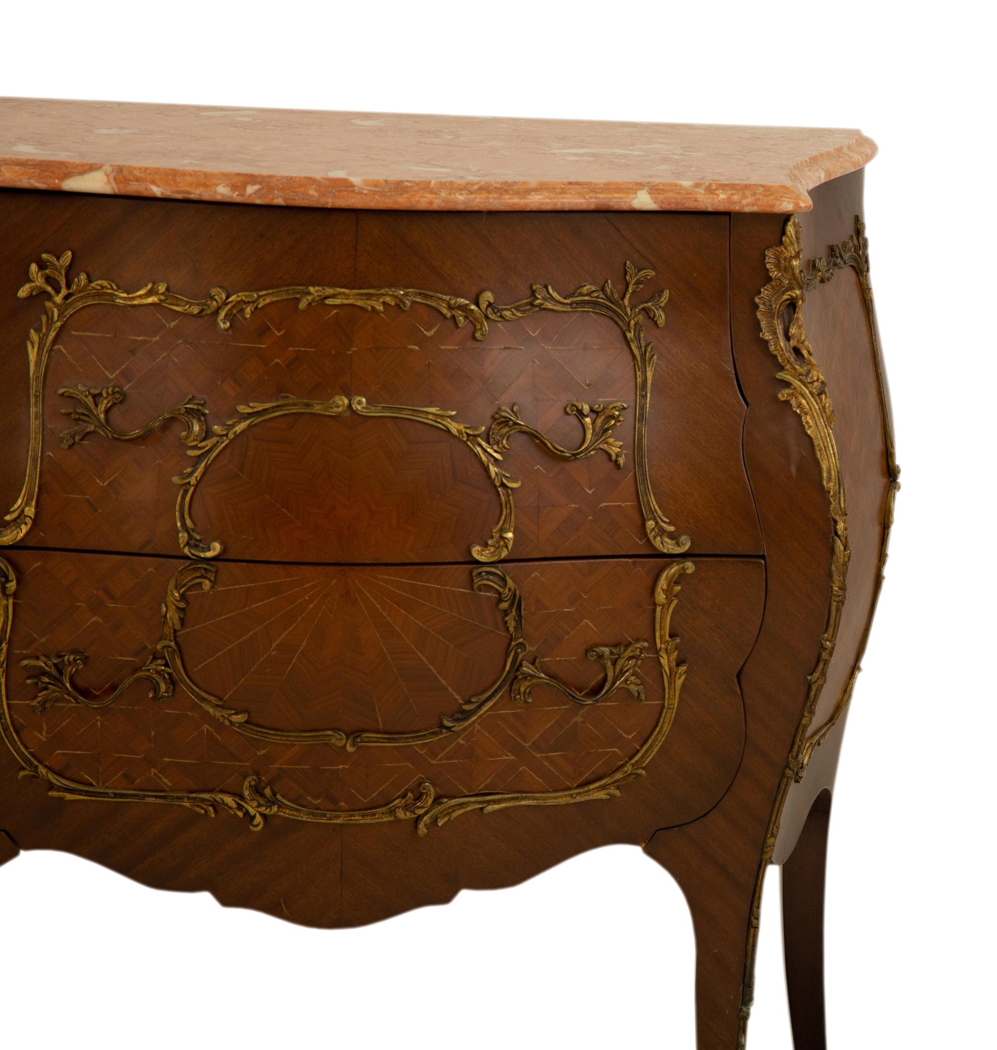 A Louis XV Style Gilt Bronze Mounted Marble Top Bombe Commode