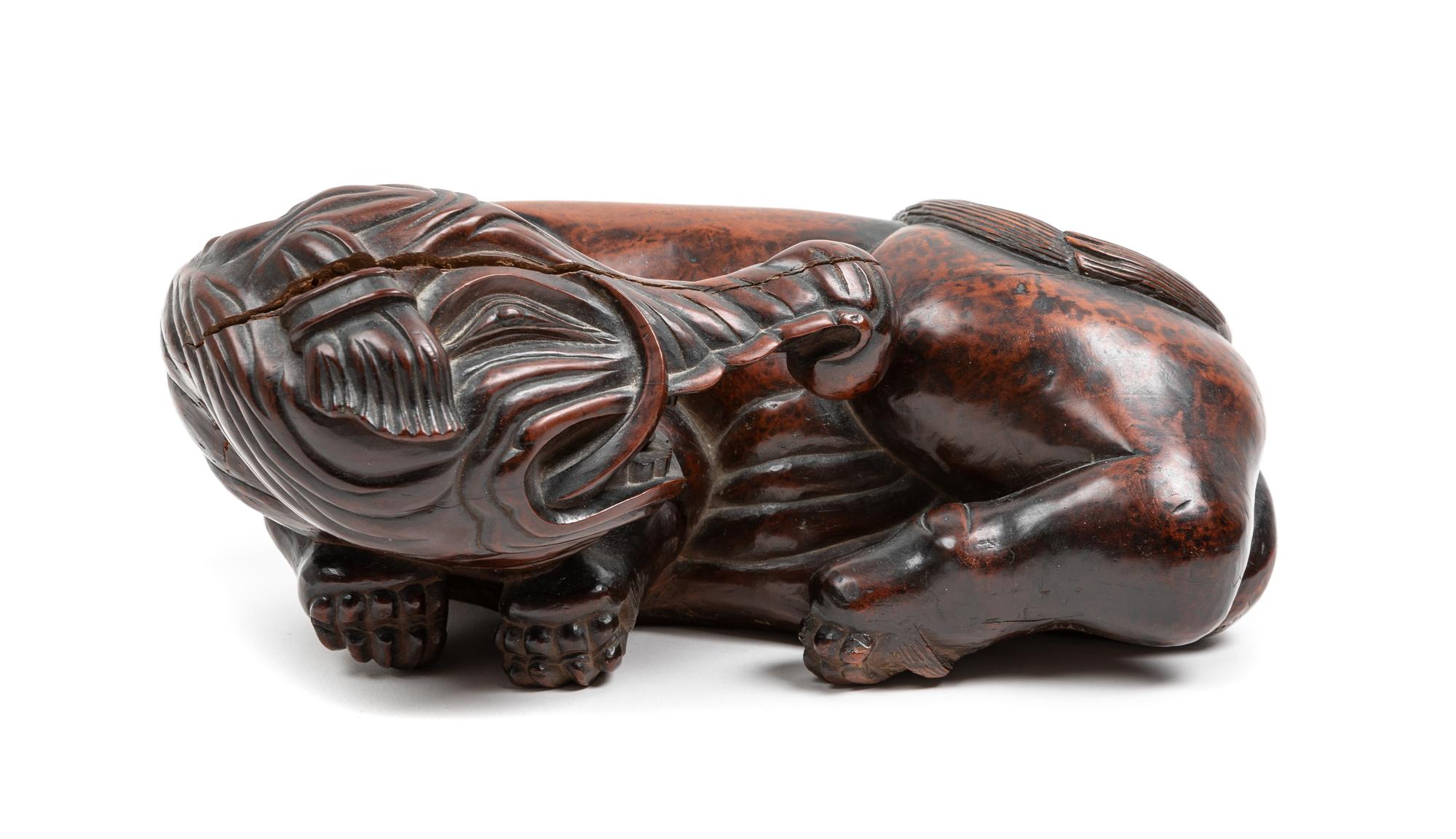 A Chinese Hardwood Figure of an Elephant Length 11 1/2 inches. — 20TH CENTURY