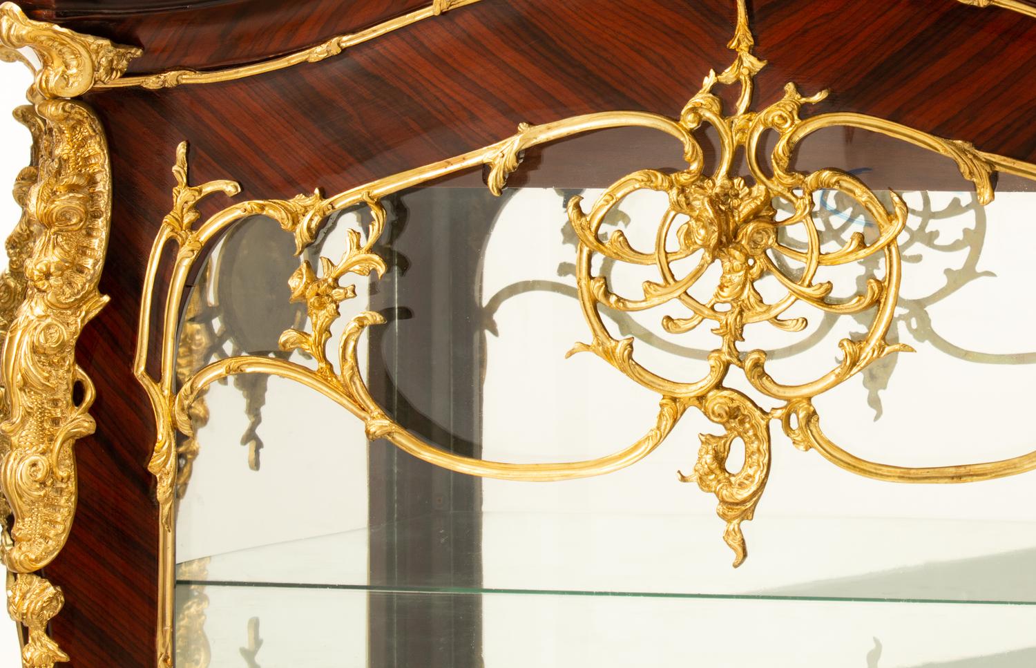 A Pair of Louis XV Style Gilt Bronze Mounted Vitrine Cabinets