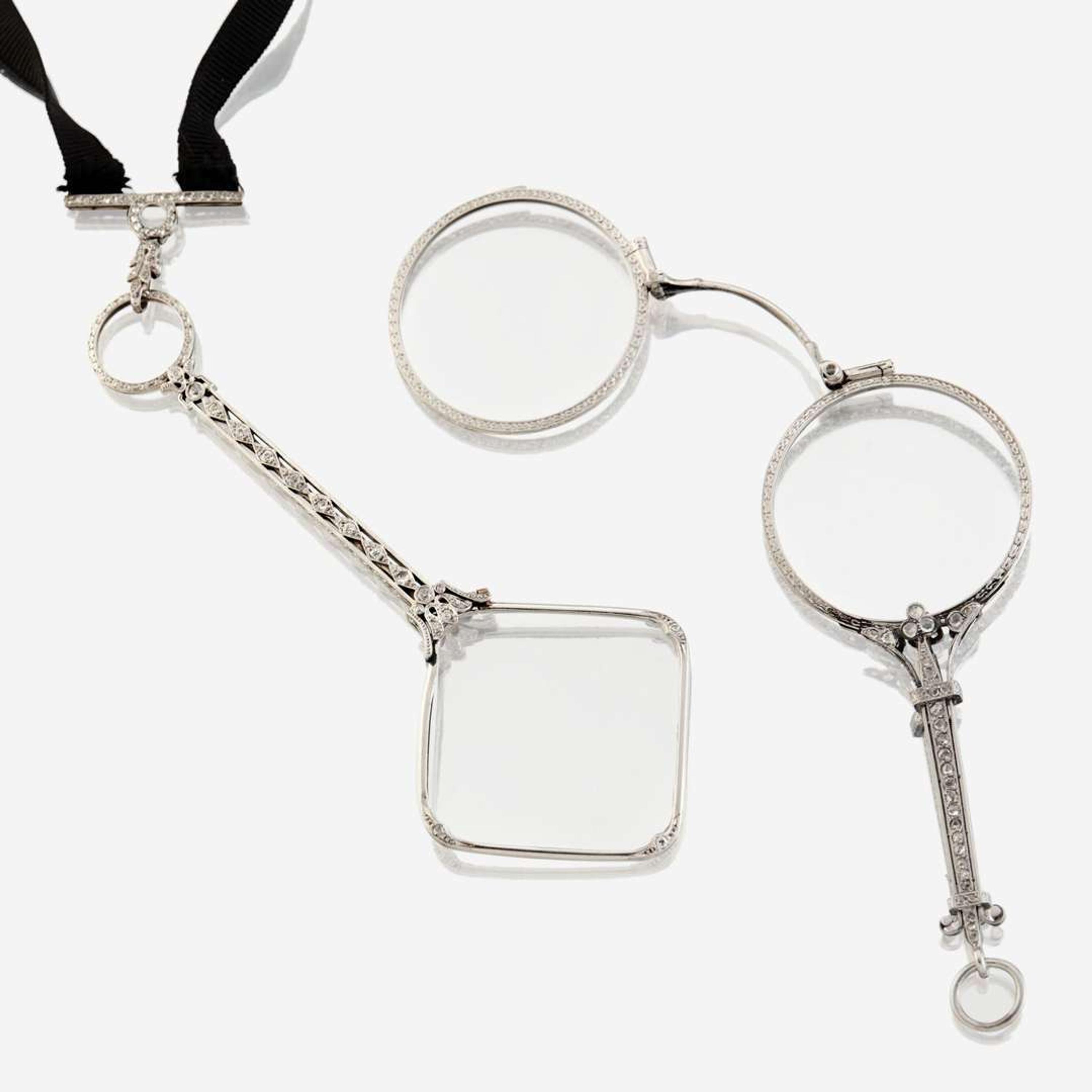 A pair of Edwardian platinum and diamond lorgnettes