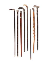 A Collection of Eight Silver and Silvered Metal Canes and Walking Sticks