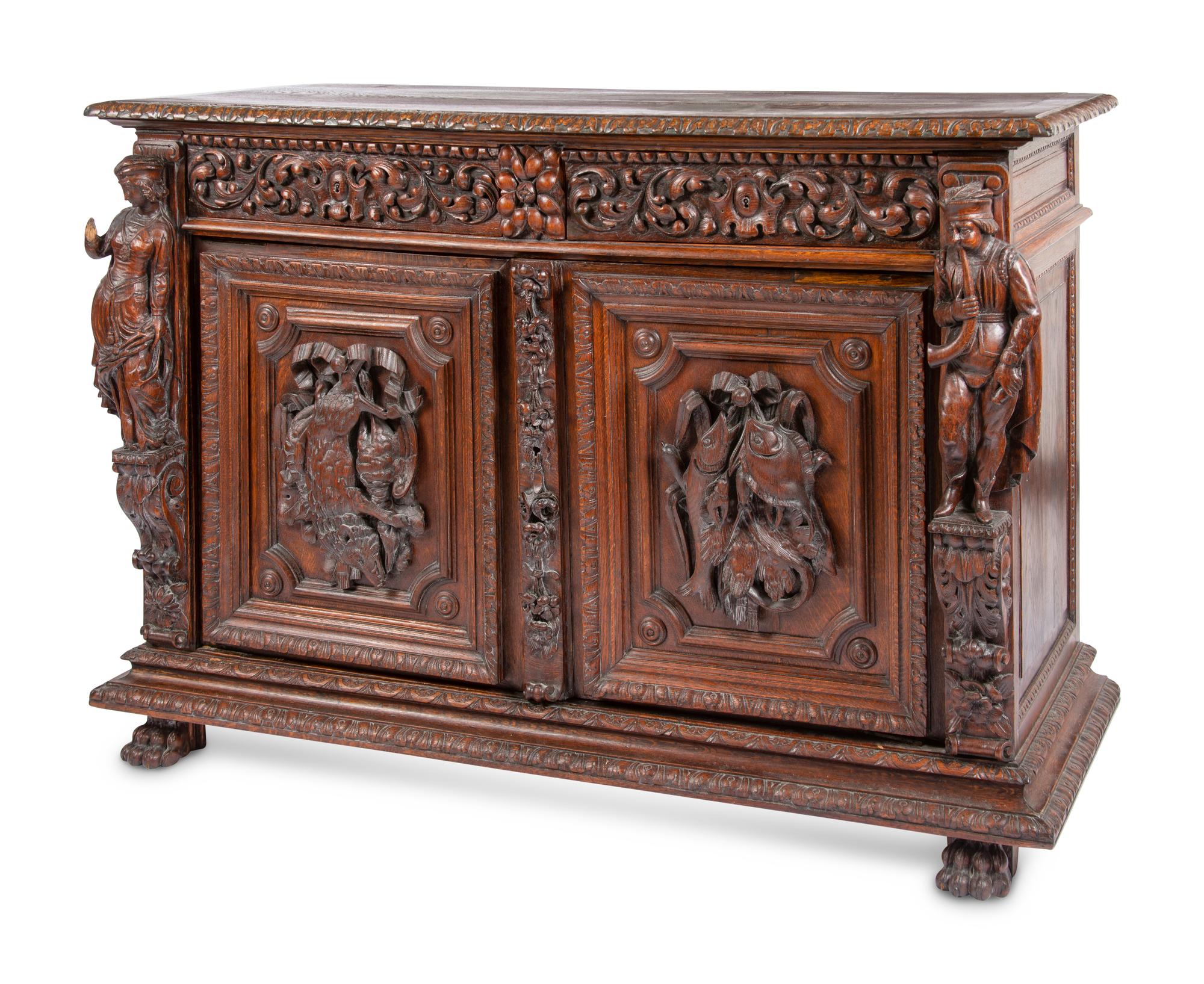 A Continental Carved Oak Cabinet