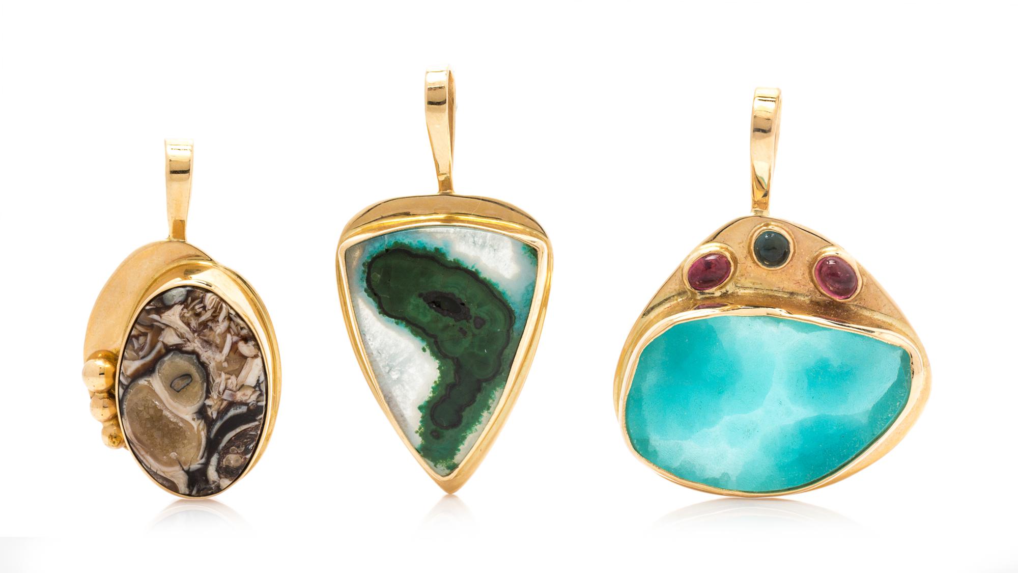 A Collection of 14 Karat Yellow Gold and Gemstone Pendants, 12.10 dwts.