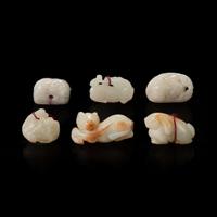 Group of six small white jade animal-form pendants