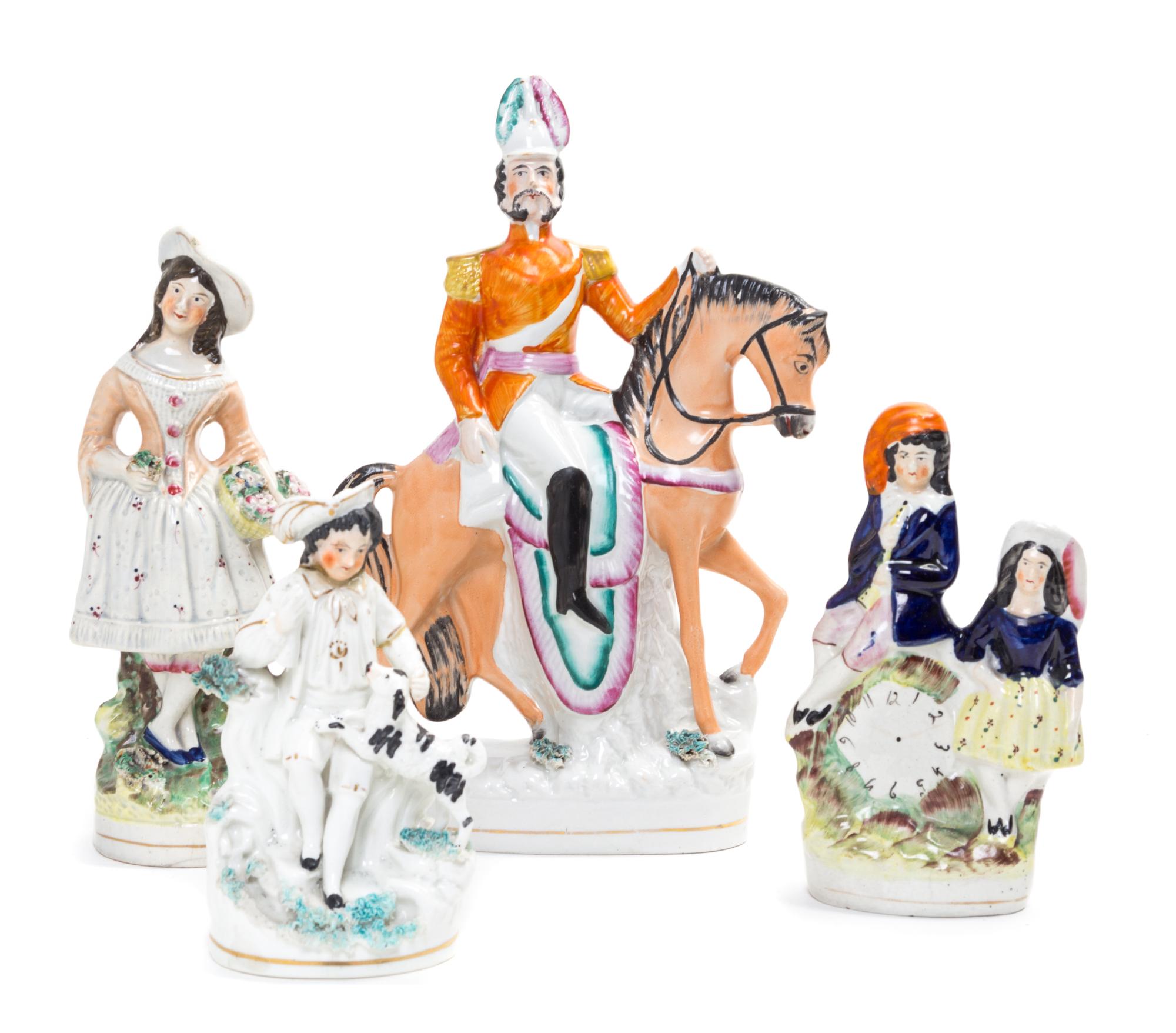 Four Staffordshire Figural Groups Height of tallest 11 3/8 inches.
