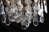 A Louis XV Style Bronze and Glass Twelve-Light Chandelier