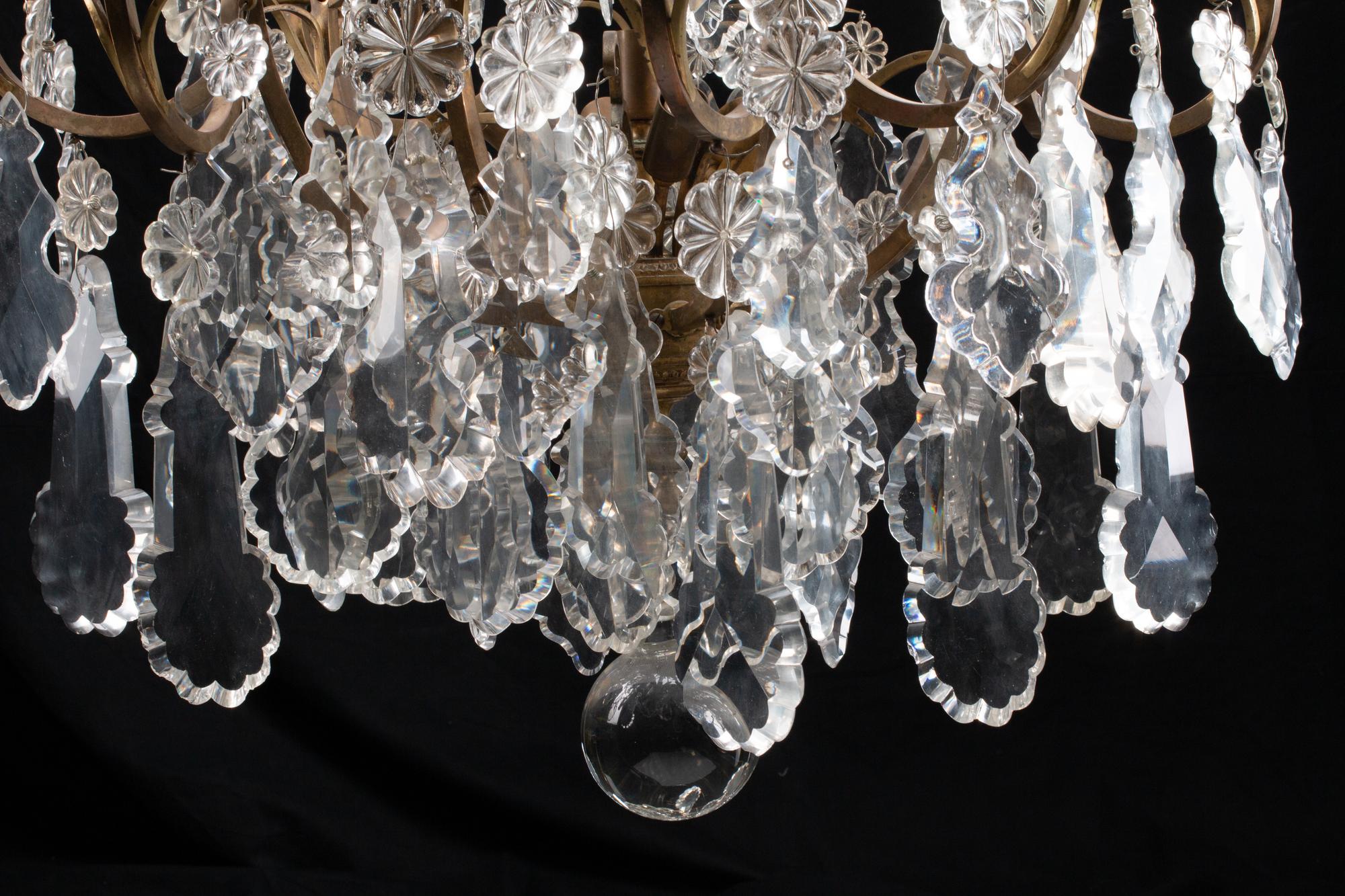 A Louis XV Style Bronze and Glass Twelve-Light Chandelier