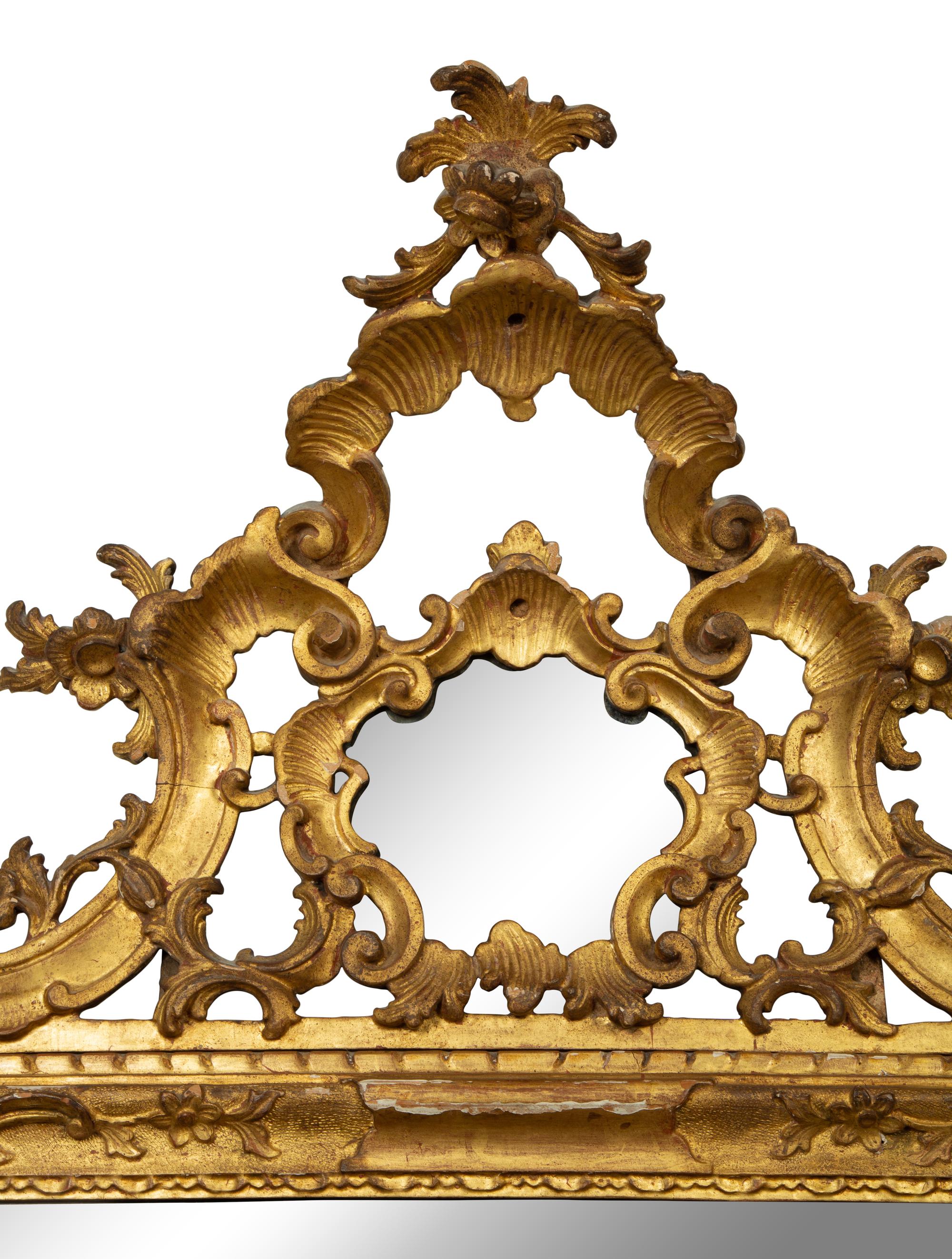 An Italian Rococo Carved Giltwood Mirror — 18TH CENTURY