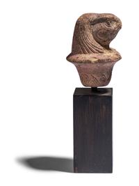 An Egyptian Stone Wadj Fragment with the Head of a Falcon