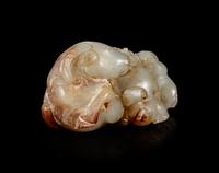 A Carved Celadon and Russet Jade 'Three Rams' Group