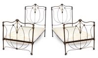A Pair of Victorian Style Patinated Iron and Brass Twin Bedsteads Width 39 inches.