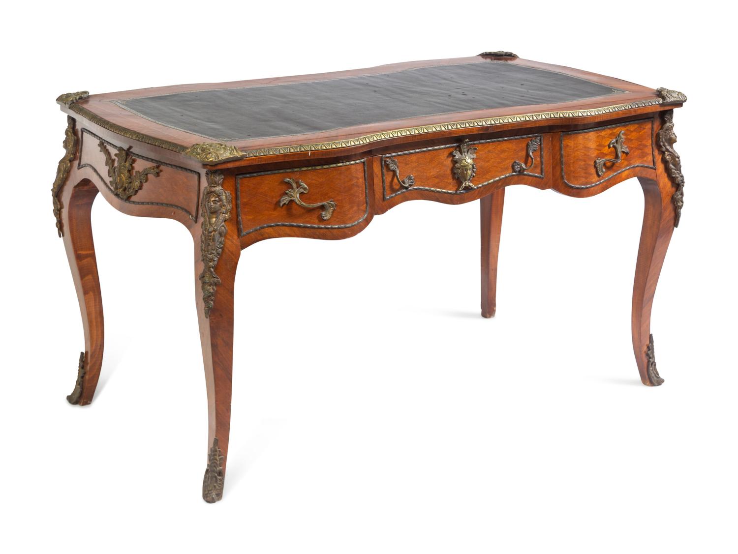 A Louis XV Style Gilt Metal Mounted Walnut Bureau Plat