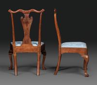 A Pair of Queen Anne Carved Walnut Trifid Foot Side Chairs