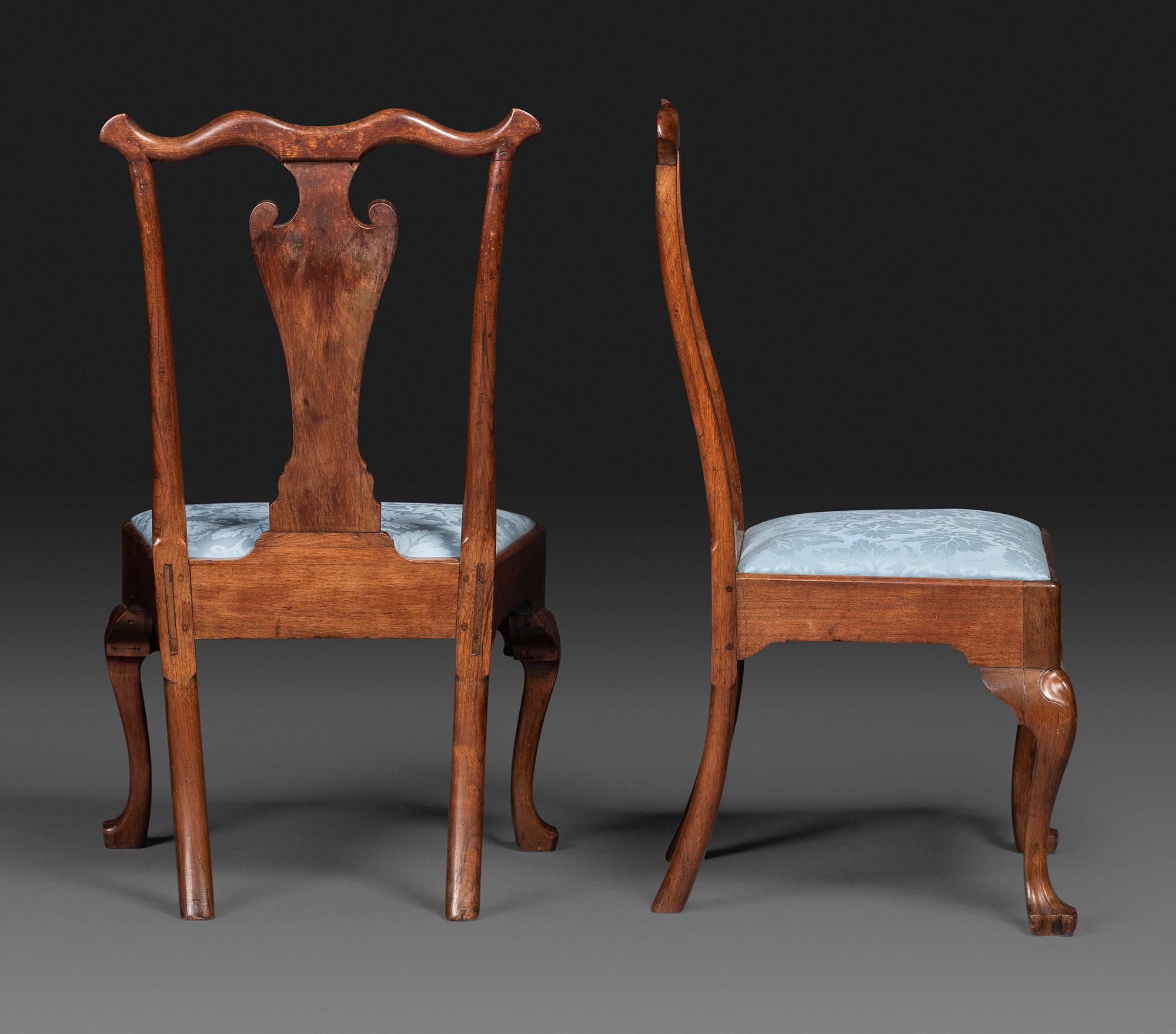 A Pair of Queen Anne Carved Walnut Trifid Foot Side Chairs