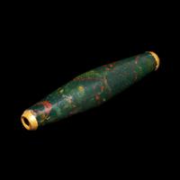 A Near Eastern Bloodstone Bead with Gold Caps