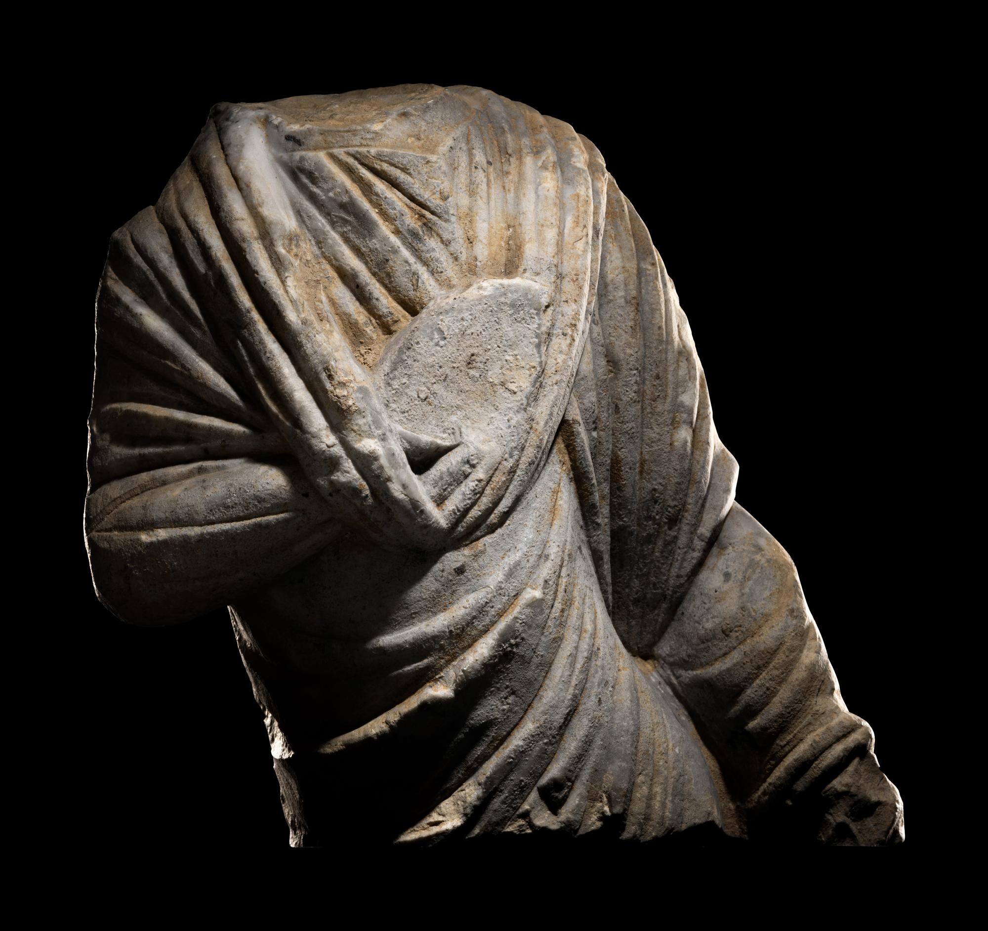 A Roman Marble Draped Torso from a Relief