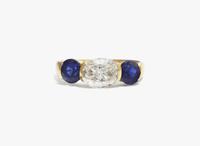 A Three-Stone Diamond and Sapphire Ring