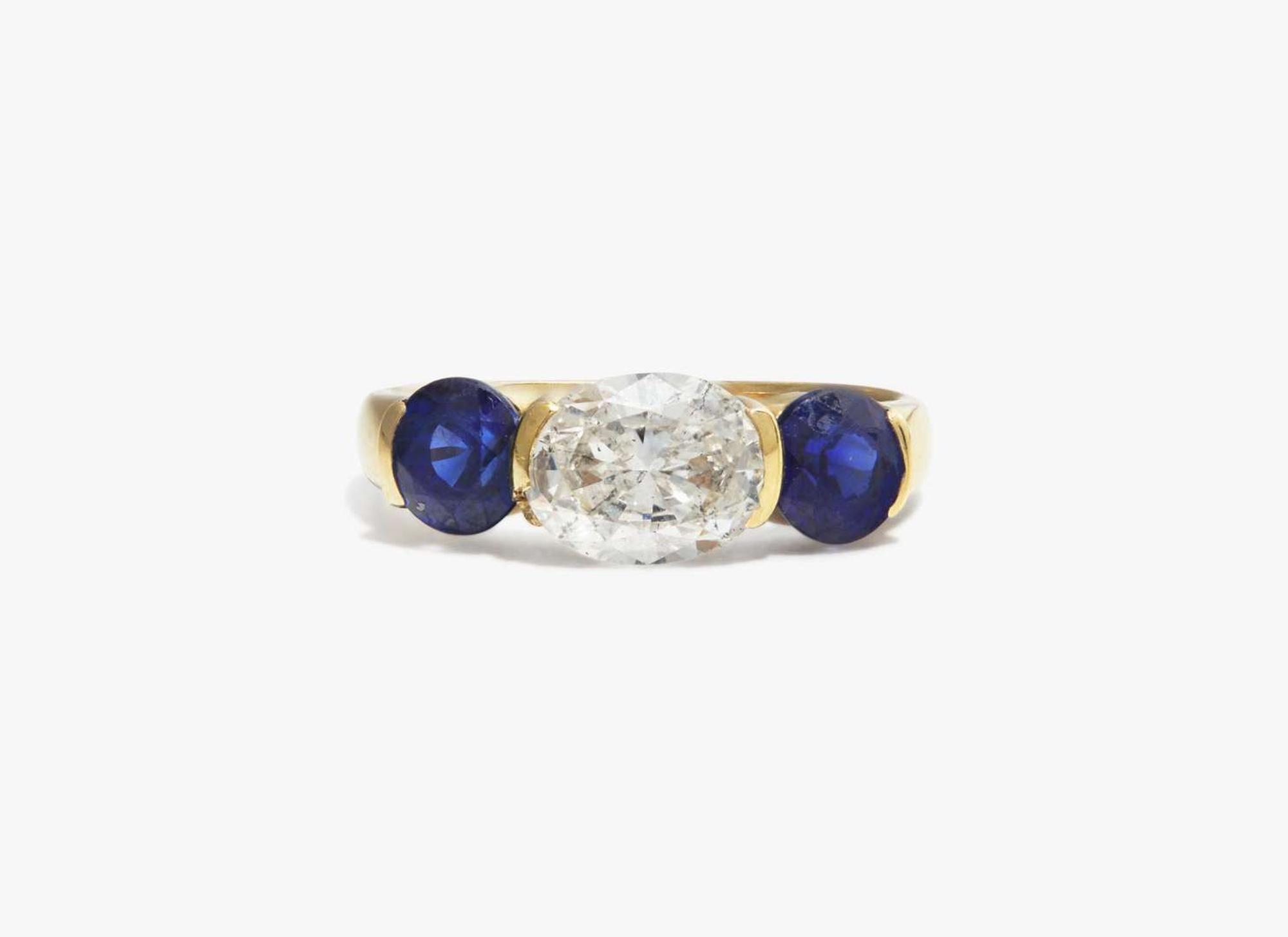 A Three-Stone Diamond and Sapphire Ring