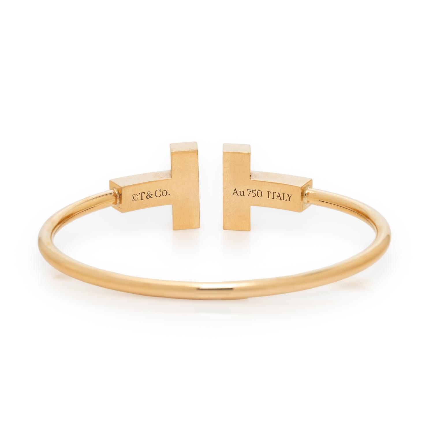 TIFFANY & CO., MOTHER-OF-PEARL AND YELLOW GOLD 'T' WIRE CUFF BRACELET