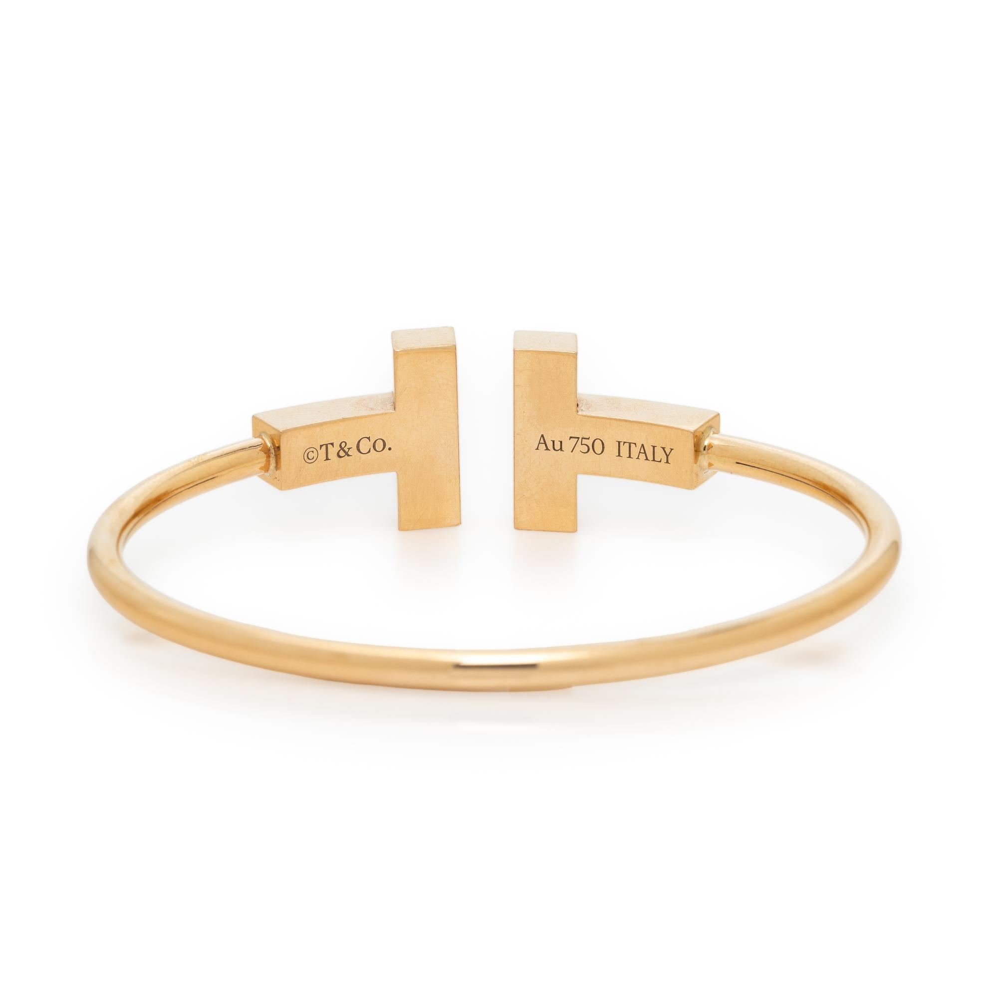 TIFFANY & CO., MOTHER-OF-PEARL AND YELLOW GOLD 'T' WIRE CUFF BRACELET