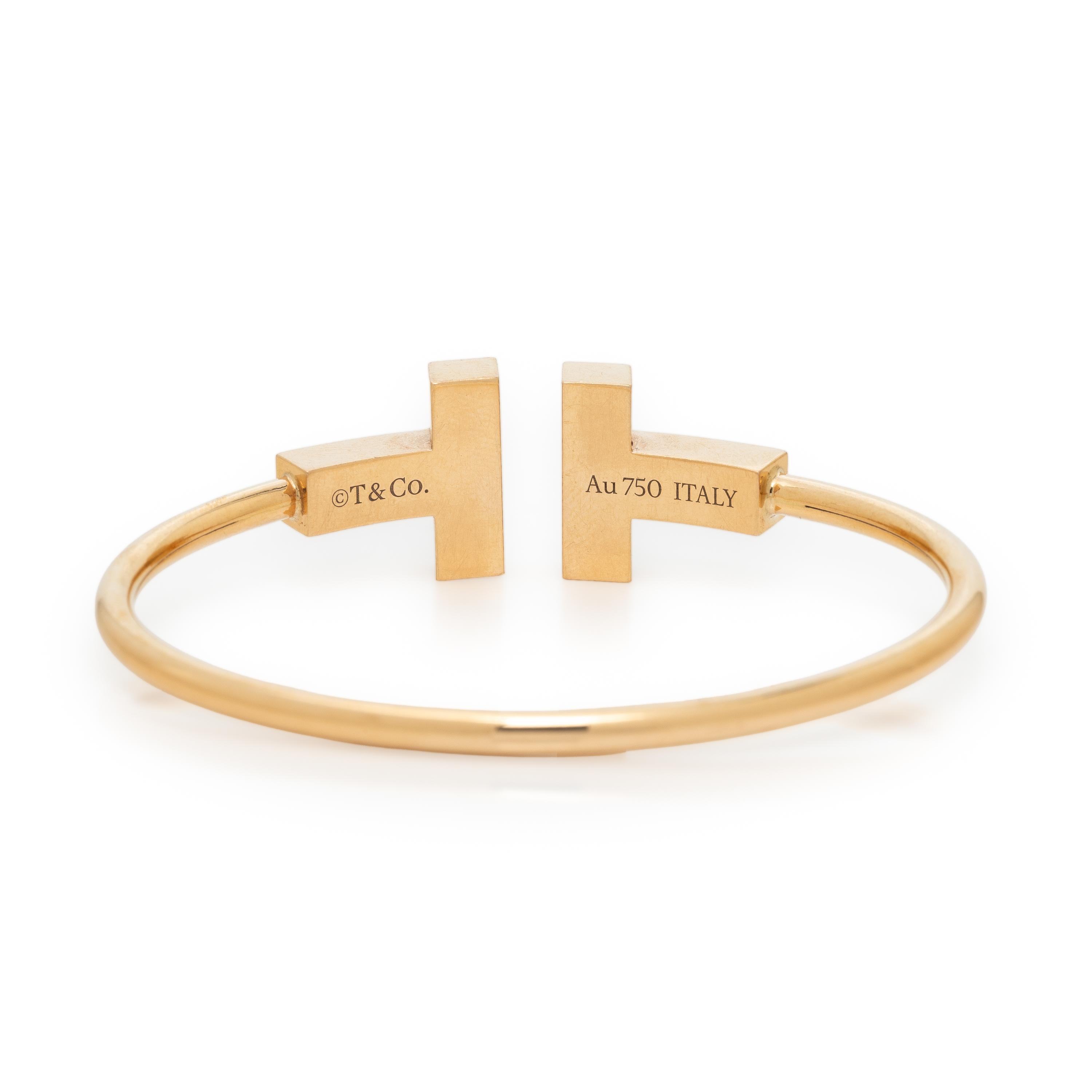 TIFFANY & CO., MOTHER-OF-PEARL AND YELLOW GOLD 'T' WIRE CUFF BRACELET