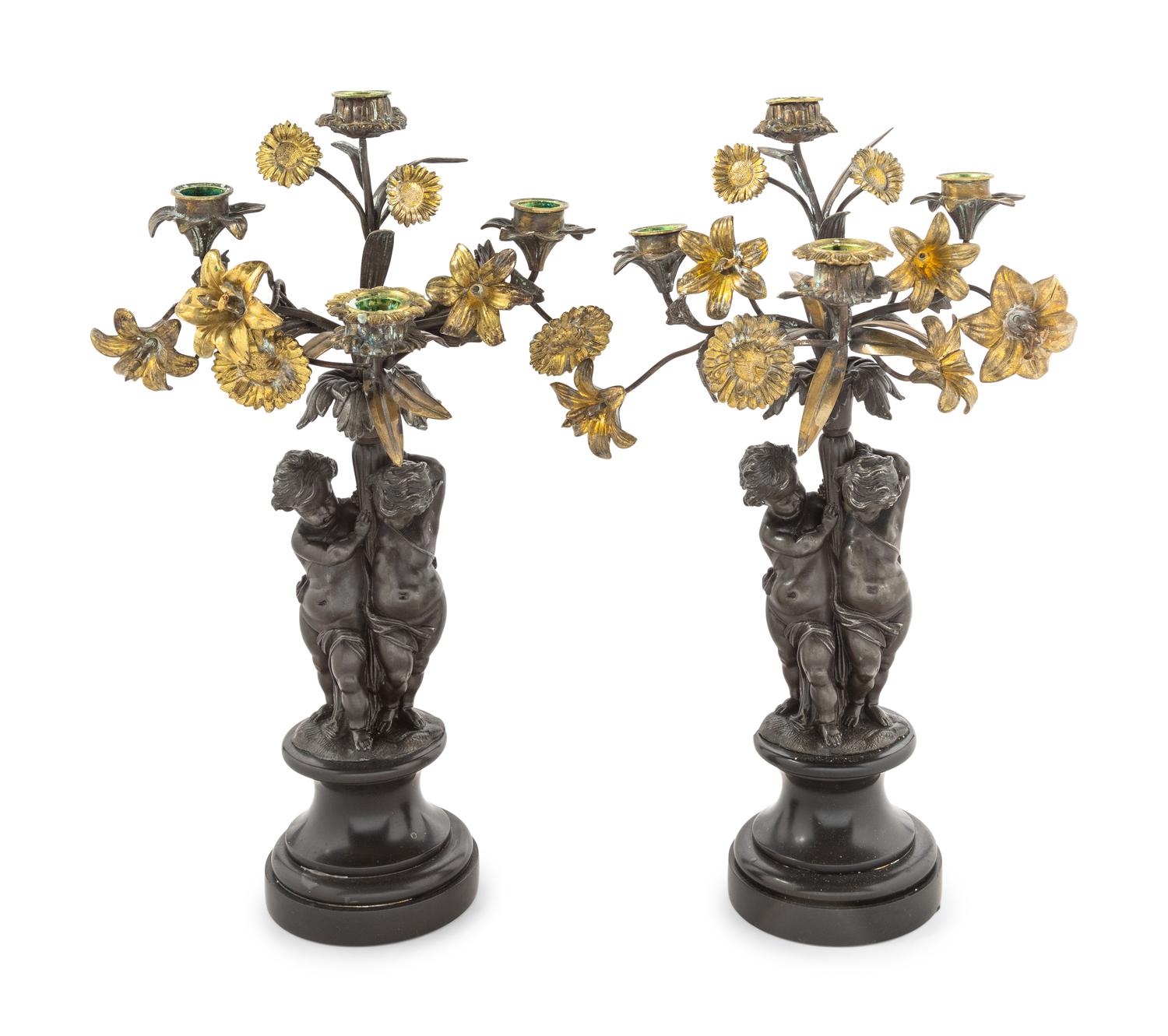 A Pair of Victorian Cast Metal and Parcel Gilt Four-Light Candelabra