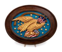A Carved and Painted Eagle and a Carved, Painted and Parcel Gilt Eagle Plaque