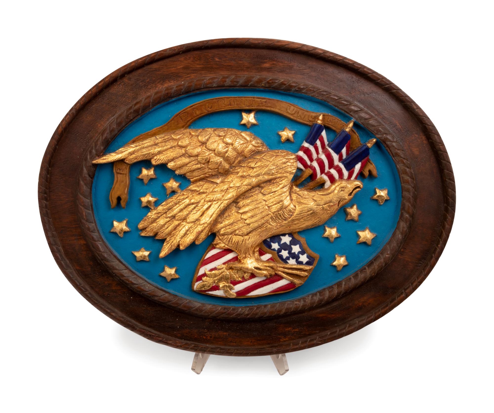 A Carved and Painted Eagle and a Carved, Painted and Parcel Gilt Eagle Plaque