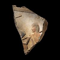 An Egyptian Painted Limestone Relief Fragment