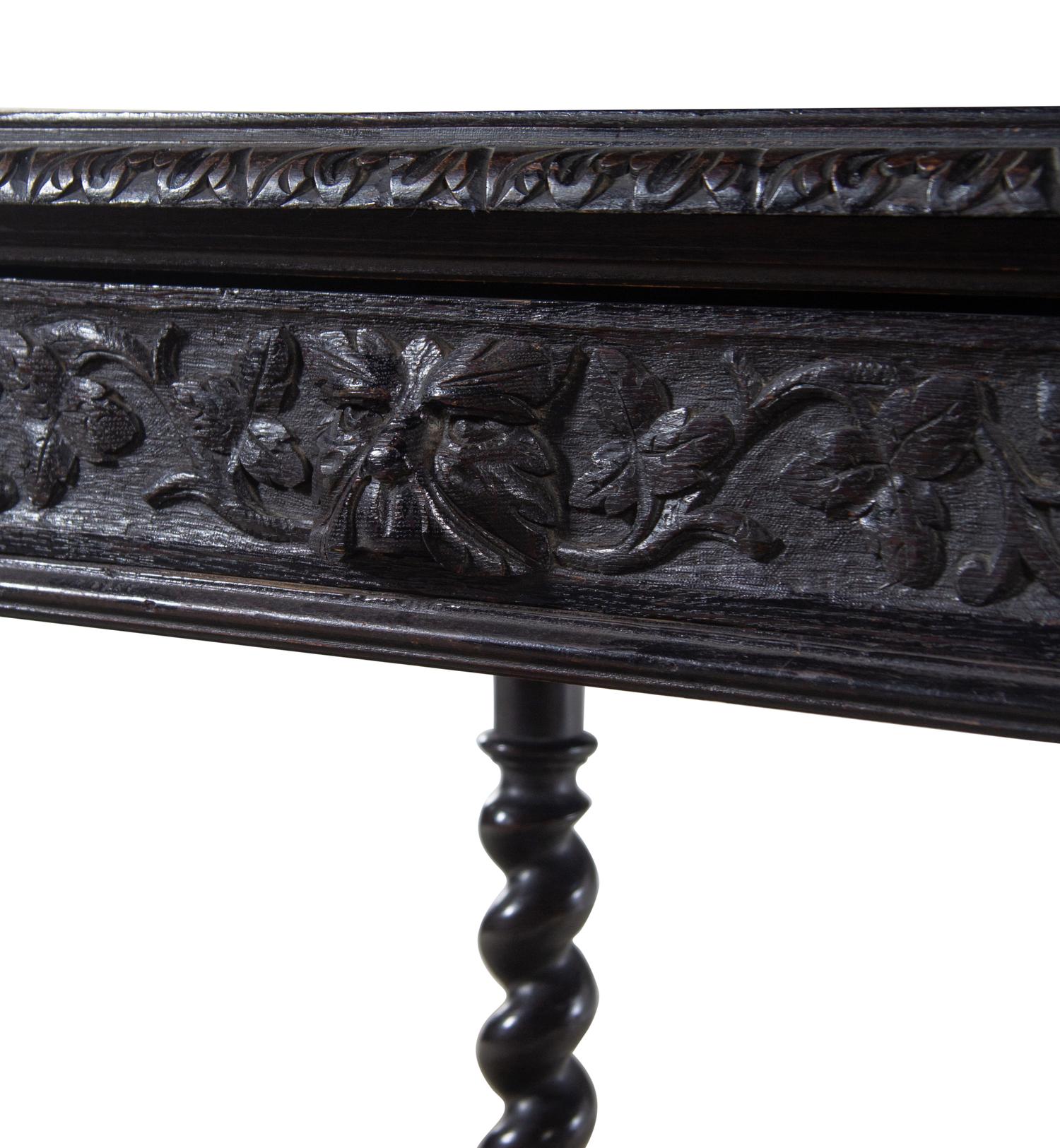 A Renaissance Revival Carved Walnut Table