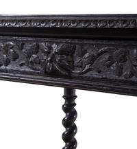 A Renaissance Revival Carved Walnut Table